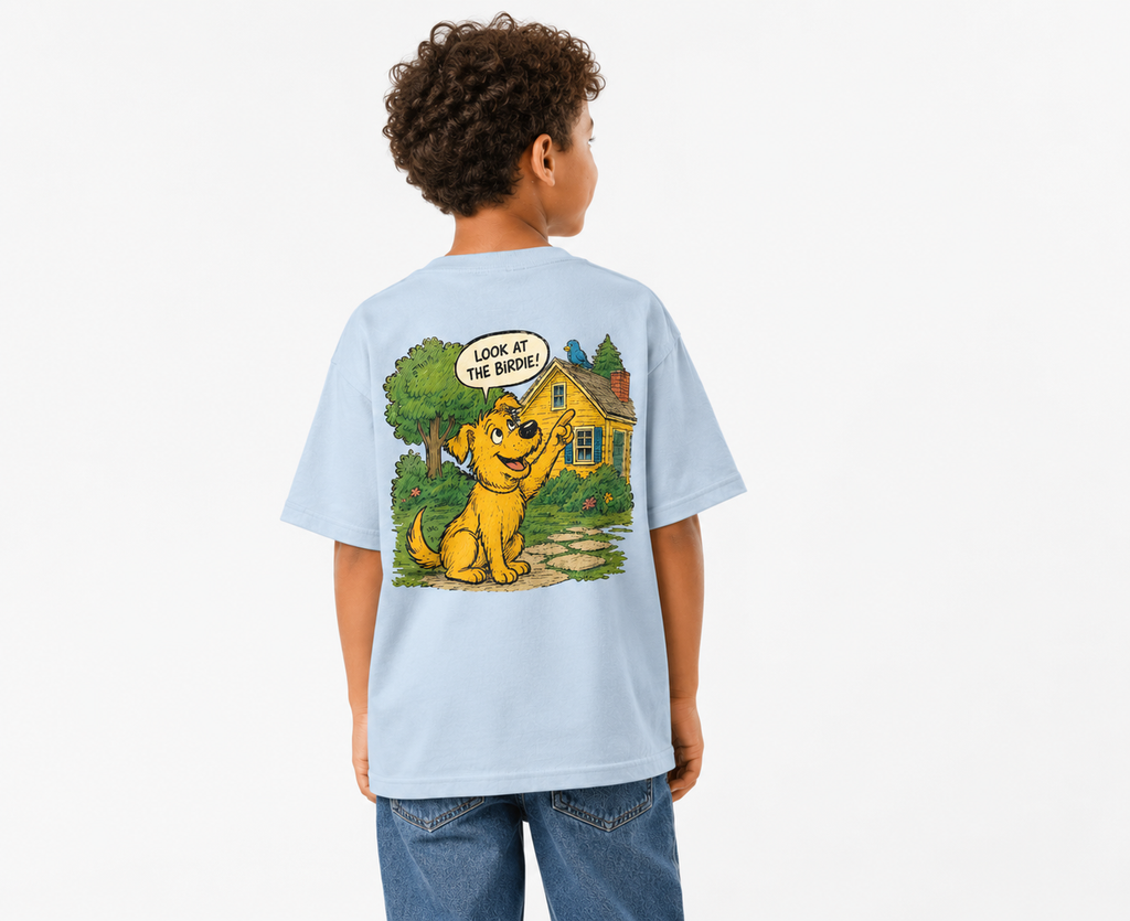 Child wearing a light blue t-shirt with a cartoon dog design on the back.The dog is pointing at a bird saying look at that birdie