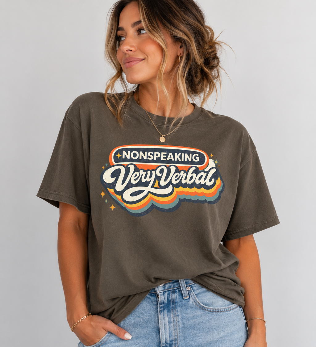 Woman wearing a brown t-shirt with 'Nonspeaking Very Verbal' text design on a plain background