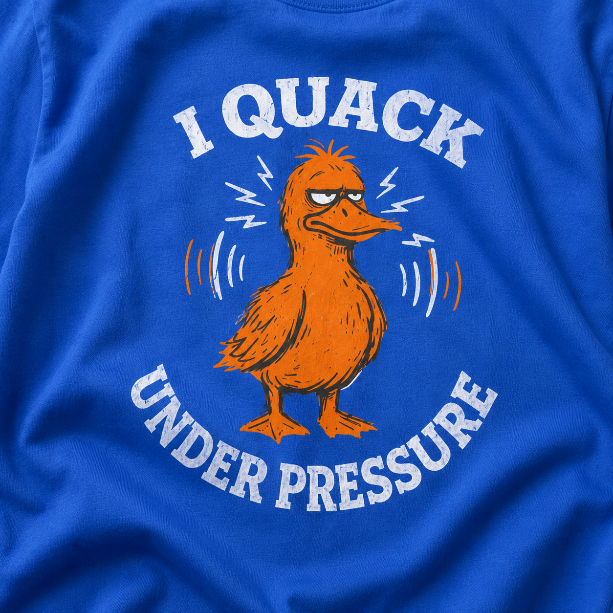 Blue t-shirt with a cartoon duck and text 'I Quack Under Pressure' on a blue background