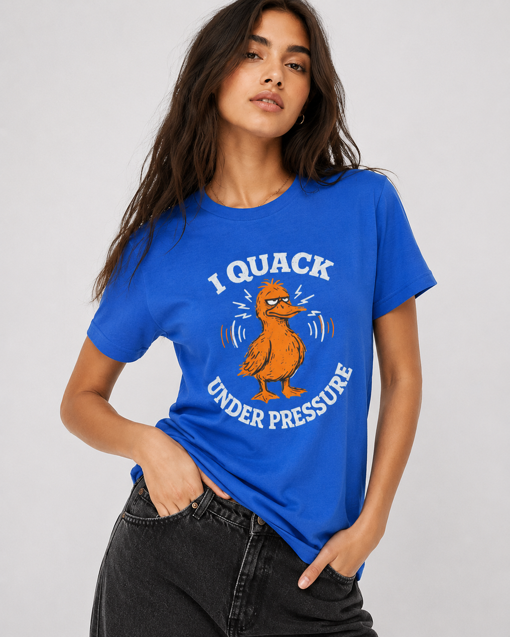 Woman wearing a blue t-shirt with a duck graphic and text on a plain background