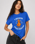 Woman wearing a blue t-shirt with a duck graphic and text on a plain background